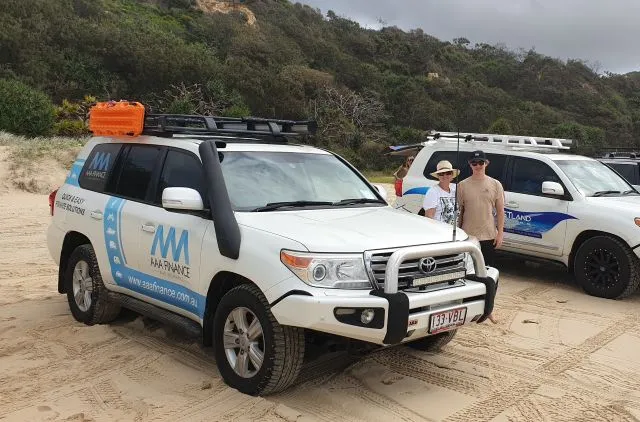 4WD vehicles set up for a K'gari camping trip, showcasing AAA Finance's vehicle financing options for your next adventure.