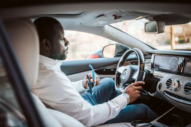 Man driving a car, representing low doc car loan eligibility.