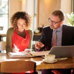 Finance broker advising a business owner on managing a low doc car loan