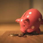 Piggy bank saving money with coins for business car finance