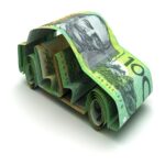 An image of paper money creatively folded into the shape of a car, symbolizing car finance. The design conveys the concept of using money wisely with pre-approved finance during the End of Financial Year (EOFY) period. The background is clean and minimal, keeping focus on the money car as a visual metaphor for smart financial planning.
