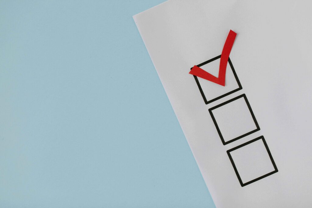 A simple EOFY financial health checklist graphic showing three boxes in a vertical layout. The first box is ticked, while the other two remain empty. Each box represents a key task for preparing a business for tax time, set against a clean, professional background to emphasize clarity and focus.