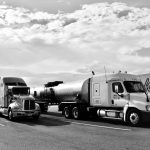 Two commercial trucks parked at a logistics depot, representing EOFY 2026 business finance and asset funding opportunities for Australian businesses.
